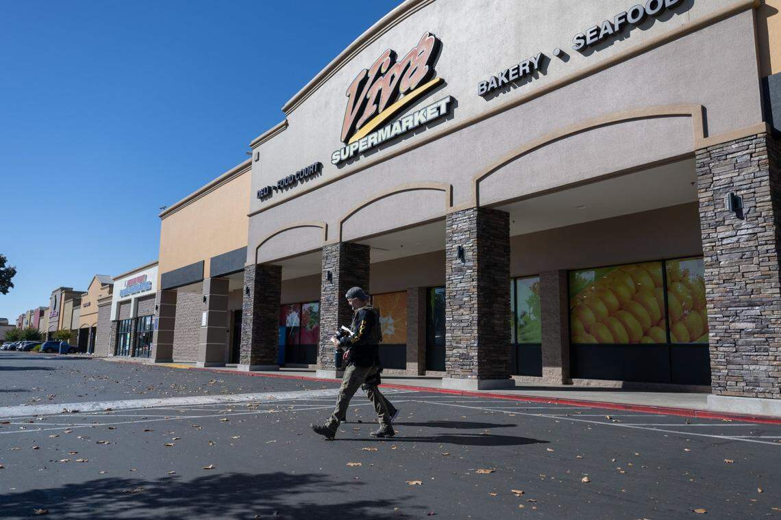 Homeland Security Investigations officers leave the Viva Supermarket on Folsom Boulevard in Rancho Cordova in 2023, which is owned by then-Sacramento City Councilmember Sean Loloee. Loloee is set to plead guilty Thursday to federal charges alleging he underpaid undocumented workers, committed fraud and obstructed investigations tied to his Sacramento-area grocery stores.