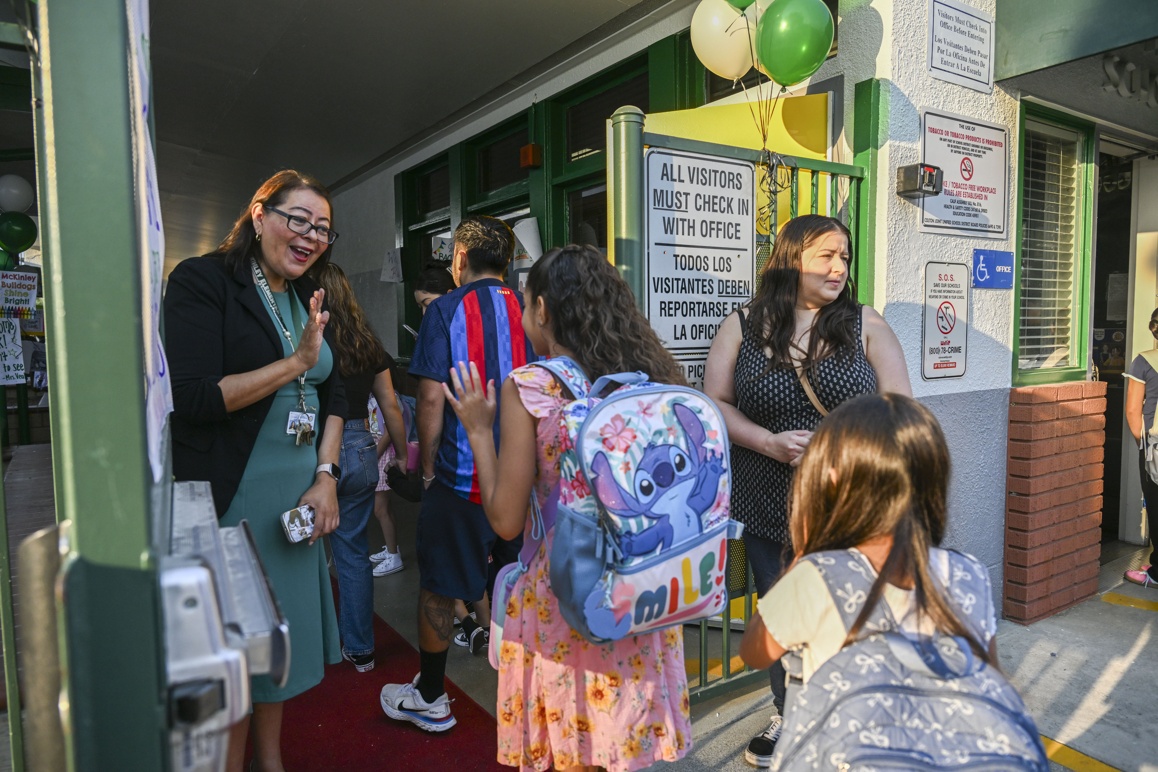 Jennifer Pedroza, principal of Coltonâs McKinley Elementary School, welcome students...