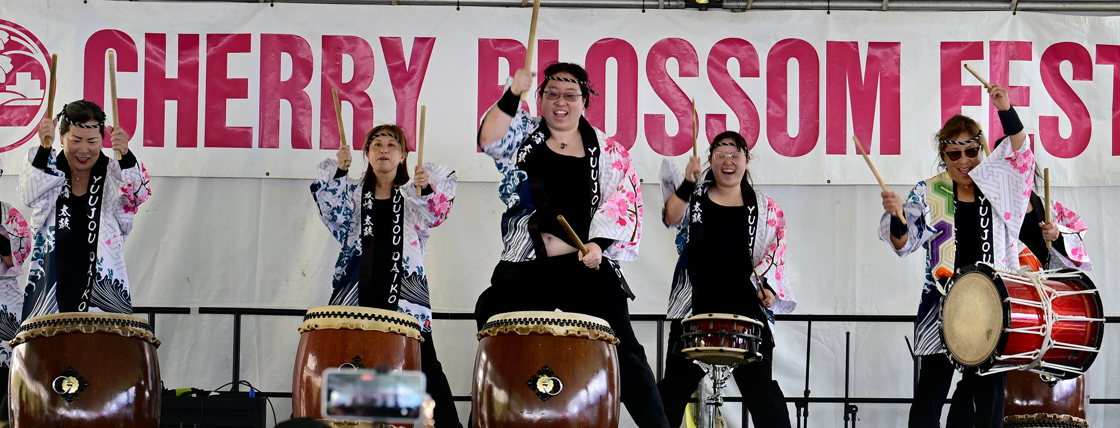 Taiko drummers from the group Yuujou perform. People attending the...