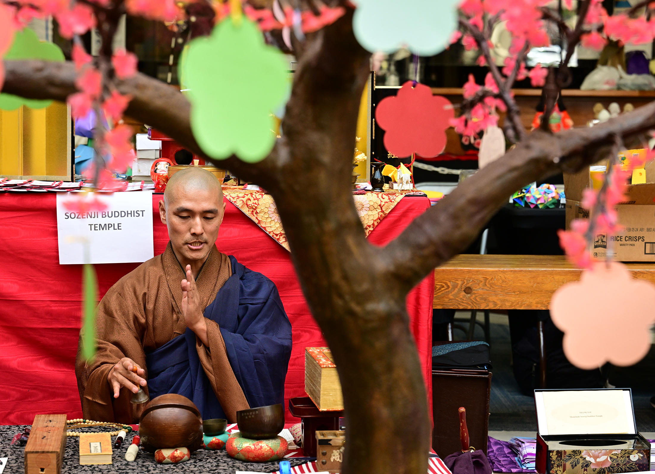 Gyokei Yokoyama uses Buddhist meditation instruments. People attending the Cherry...