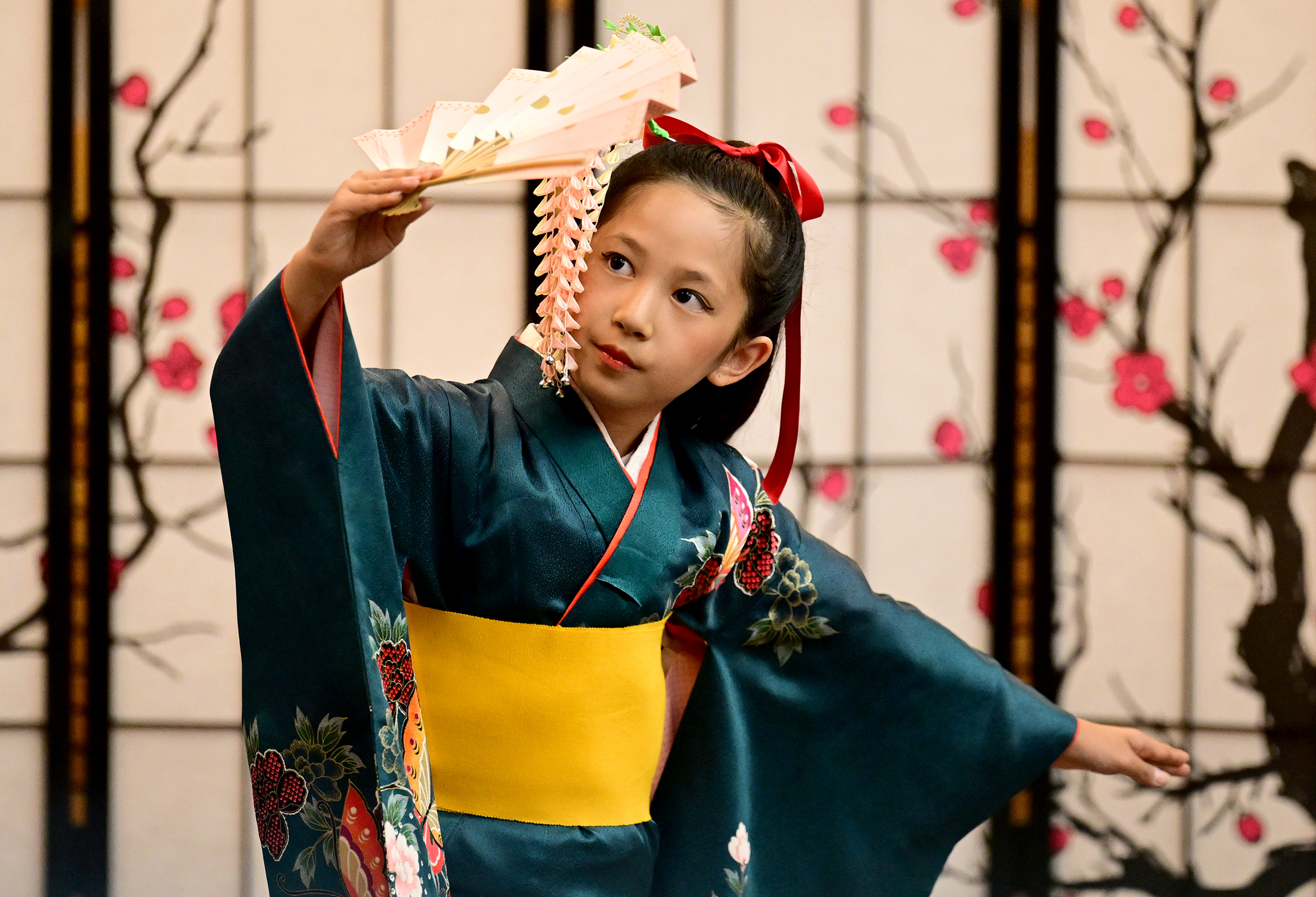 A young dancer from Kyo No Kai does a traditional...