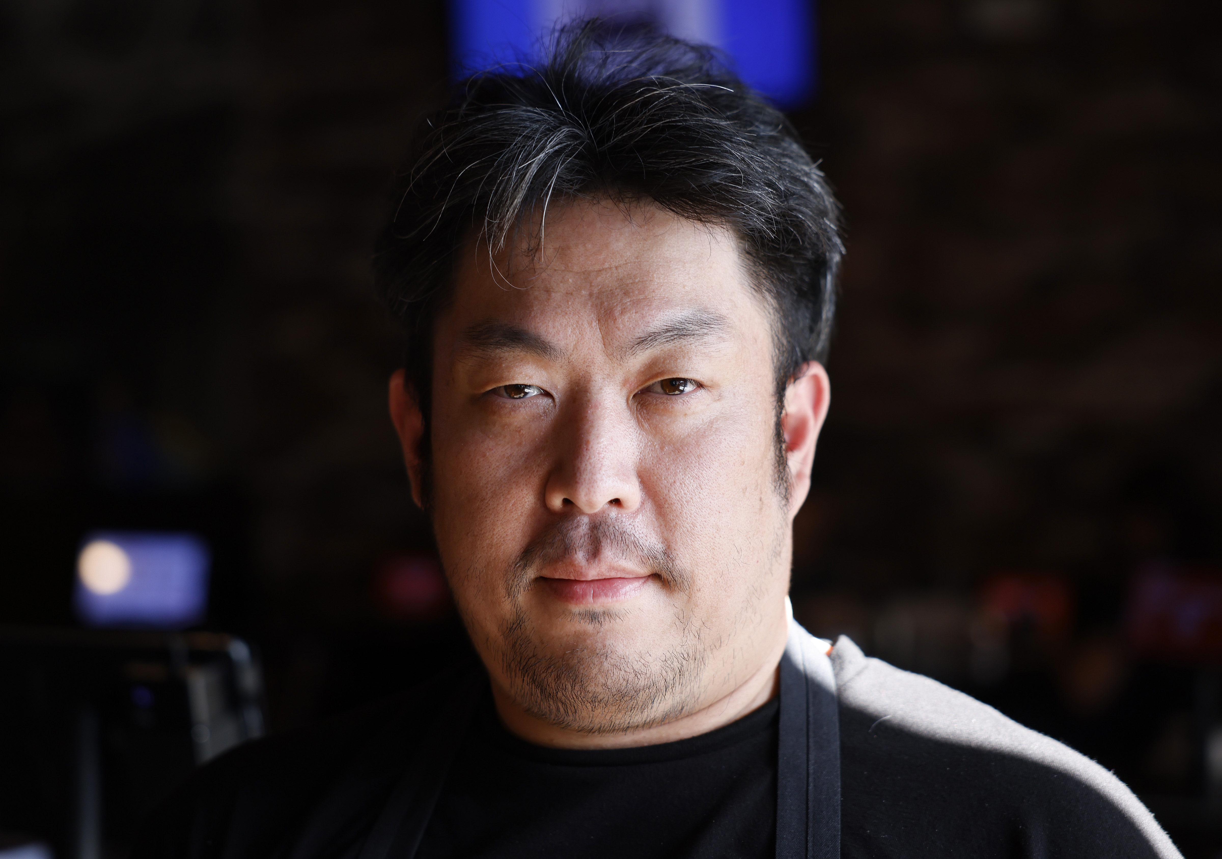 Jinri Lee, manager at bb.q Chicken, poses for a photograph...