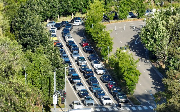 Vehicles leave the Apple Park campus via Apple Park Way to North Wolf Road in Cupertino, Calif., on Tuesday, April 14, 2026. (Nhat V. Meyer/Bay Area News Group)