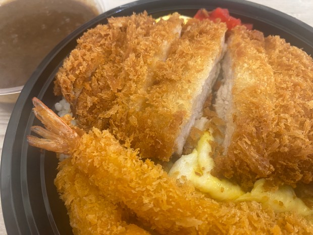 At the Mitsuwa food court in San Jose, the Katsu Curry entree with shrimp, egg omelet and Japanese curry sauce makes for a hearty meal ... or two. (Linda Zavoral/Bay Area News Group)