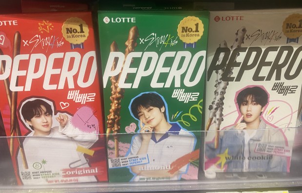 Some of the boxes of South Korean-made Pepero chocolate sticks feature the photos of K-pop stars like the Stray Kids. (Bay Area News Group)