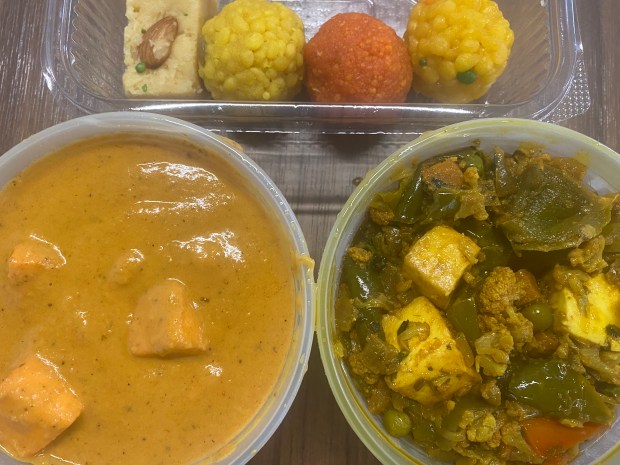 The New India Bazar in Santa Clara sells takeout containers of prepared vegetarian dishes (above, Paneer Tikka Masala and Mixed Vegetables Kadai) and Indian sweets. (Bay Area News Group)