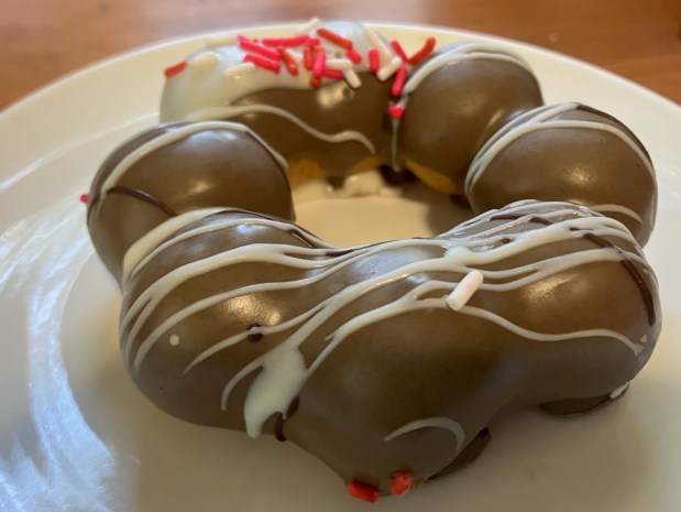 A melt-in-the-mouth matcha mochi donut with sprinkles is among the delicious treats on offer at Osaka Marketplace in Foster City. (Kate Bradshaw/Bay Area News Group)