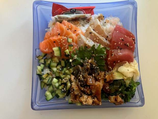 The Kuma Sushi plate at Osaka Marketplace in Foster City presents a veritable rainbow of freshly sliced sushi bites. (Kate Bradshaw/Bay Area News Group)