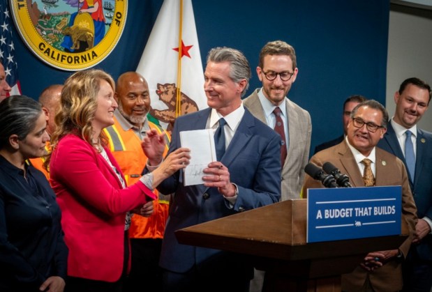 Governor's Office Gov. Gavin Newsom, alongside Assemblywoman Buffy Wicks, D-Oakland and state Sen. Scott Wiener, D-San Francisco, signs two bills Monday June 30, 2025 to reform CEQA, the California Environmental Quality Act, with the goal of building housing and other projects faster. (Photo: Governor's Office)