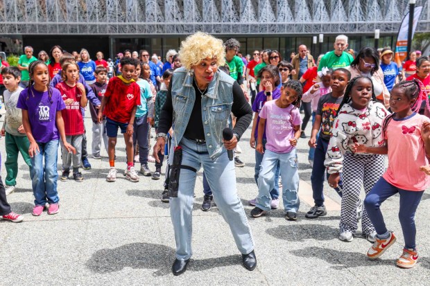 Rooftop Elementary School third graders follow the steps by Soul Line Dance instructor Chocolate Platinum of Oakland, during the Bay Area Dance Week kickoff event at Jesse Square in San Francisco, Friday, April 24, 2026. Bay Area Dance Week is a 10-day celebration of various dance styles held throughout the Bay Area. (Ray Chavez/Bay Area News Group)