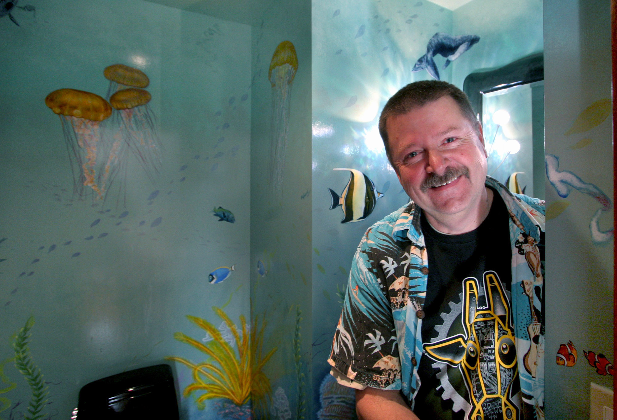 Artist Dan Fontes of San Rafael poses with his artwork...