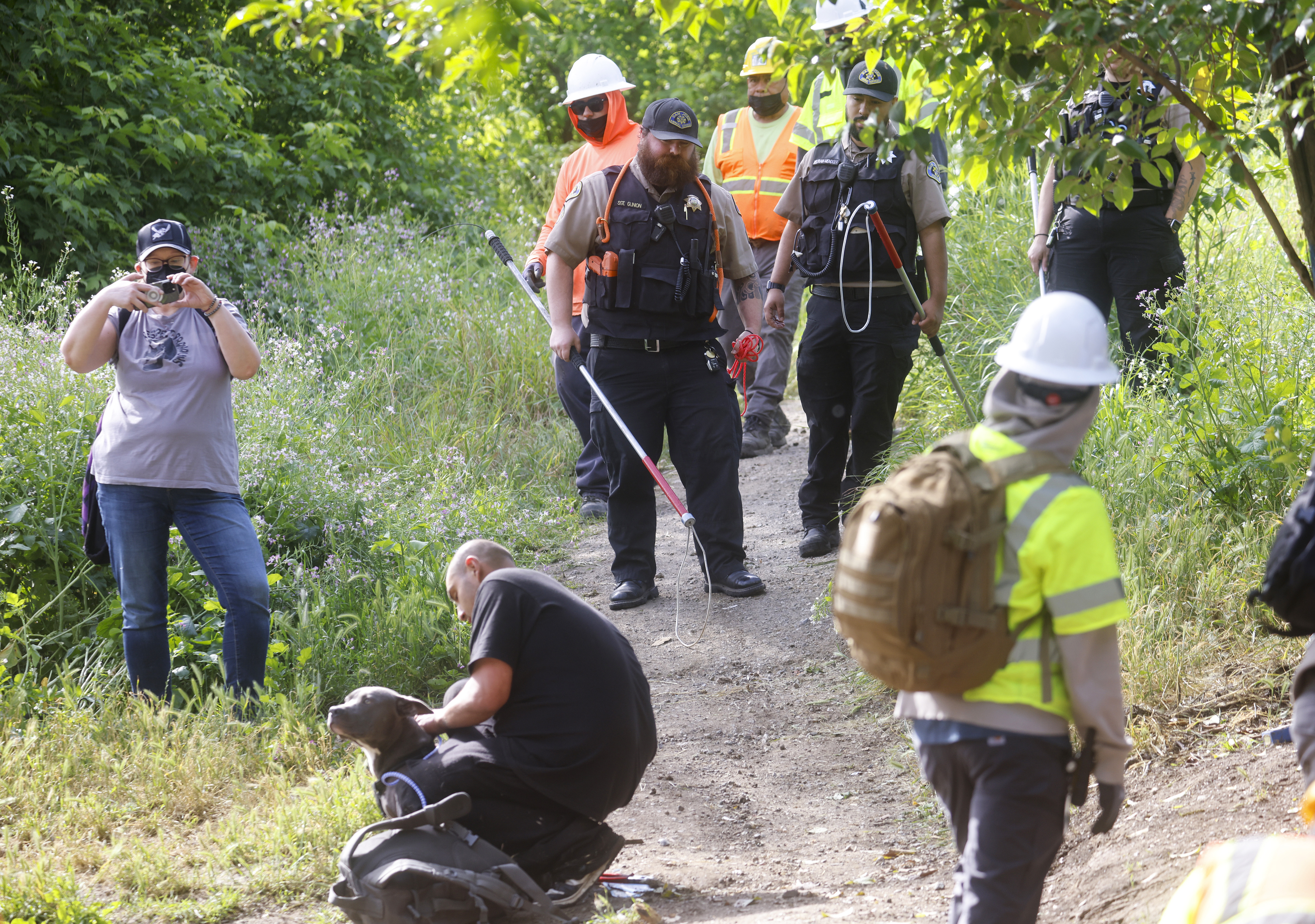 San Jose Animal Care & Services workers keep an eye...