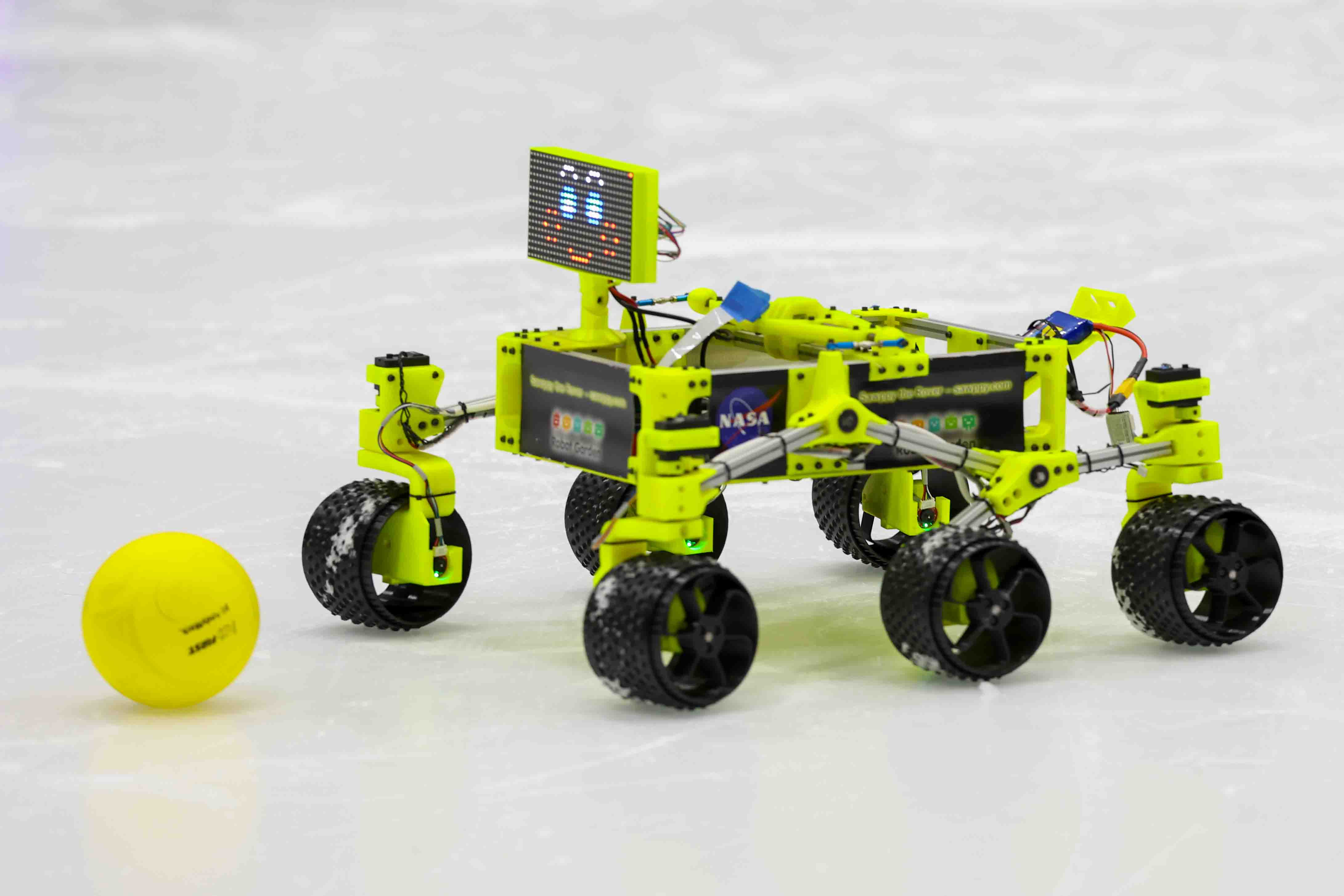 A robot moves among other robots during the Robots on...