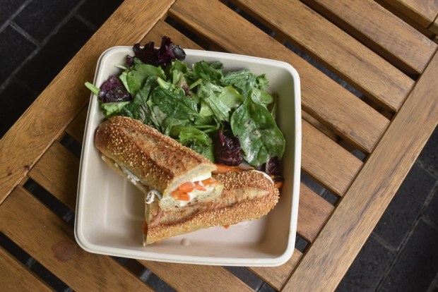 A brie, egg, carrot and mustard sandwich on house-baked sesame seed ficelle from Little Sky Kitchen in Menlo Park is a refreshing yet hearty vegetarian sandwich. (Kate Bradshaw/Bay Area News Group)