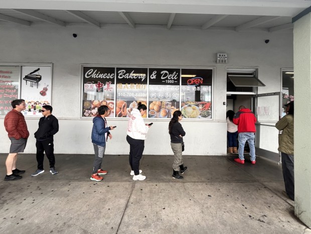 The line for food outside Chinese Bakery & Deli is shown in April 2026 in San Leandro, Calif. (John Metcalfe/Bay Area News Group)