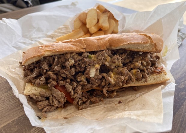 A steak hoagie with cheese from Mill's Hoagie & Deli Shop in April 2026 in Oakland, Calif. (John Metcalfe/Bay Area News Group)