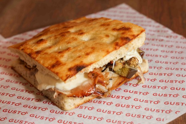 A Porchetta Italian sandwich on focaccia bread is served at Gusto Mio in Walnut Creek, Calif., Friday, April 10, 2026. (Ray Chavez/Bay Area News Group)
