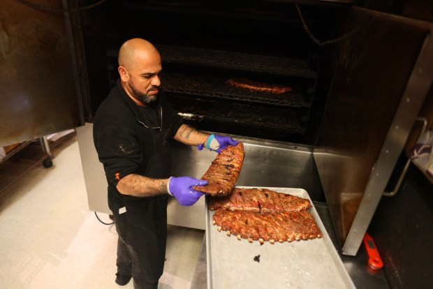 Racks of St. Louis Ribs are removed from the smoker at Slow Hand BBQ on Tuesday, April 14, 2026, in Martinez, Calif. (Aric Crabb/Bay Area News Group)
