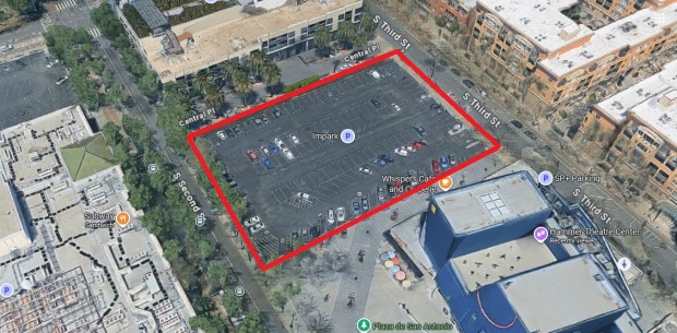 Bird's-eye view of a 1.3-acre surface parking lot in downtown San Jose between South Second Street and South Third Street near the Paseo de San Antonio, as shown within the outline. The Hammer Theatre Center is visible in the lower right of the image.(Google Maps)