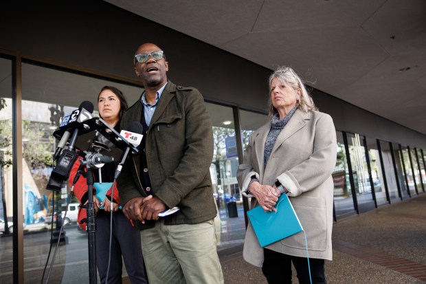 Three members of the Oakland Unified School District board, Valarie Bachelor, left, VanCedric Williams, center, and Jennifer Brouhard, hold a press conference, where they urged other board members to authorize negotiations for "common good" proposals demanded by the teachers union, outside a district office in Oakland, Calif., on May 8, 2023. The Oakland Unified School District and Oakland Education Association, which represents teachers and staff, did not reach a bargaining agreement over the weekend, pushing a strike affecting 34,000 students into its third day Monday. (Dai Sugano/Bay Area News Group)