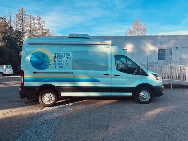 Pictured is a branded van used by the Trusted Response Urgent Support Team program in Santa Clara County. The program, which provides crisis response services without police intervention or partnering, has gotten a new direct phone line for residents in need of help with serious emotional distress and certain mental health emergencies. (Photo courtesy of Pacific Clinics)
