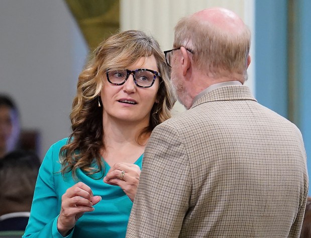Democratic Assemblymember Buffy Wicks, left, talks with Democratic state Sen. John Laird at the Capitol, in Sacramento, Calif., Thursday, Sept. 11, 2025. (AP Photo/Rich Pedroncelli, File)