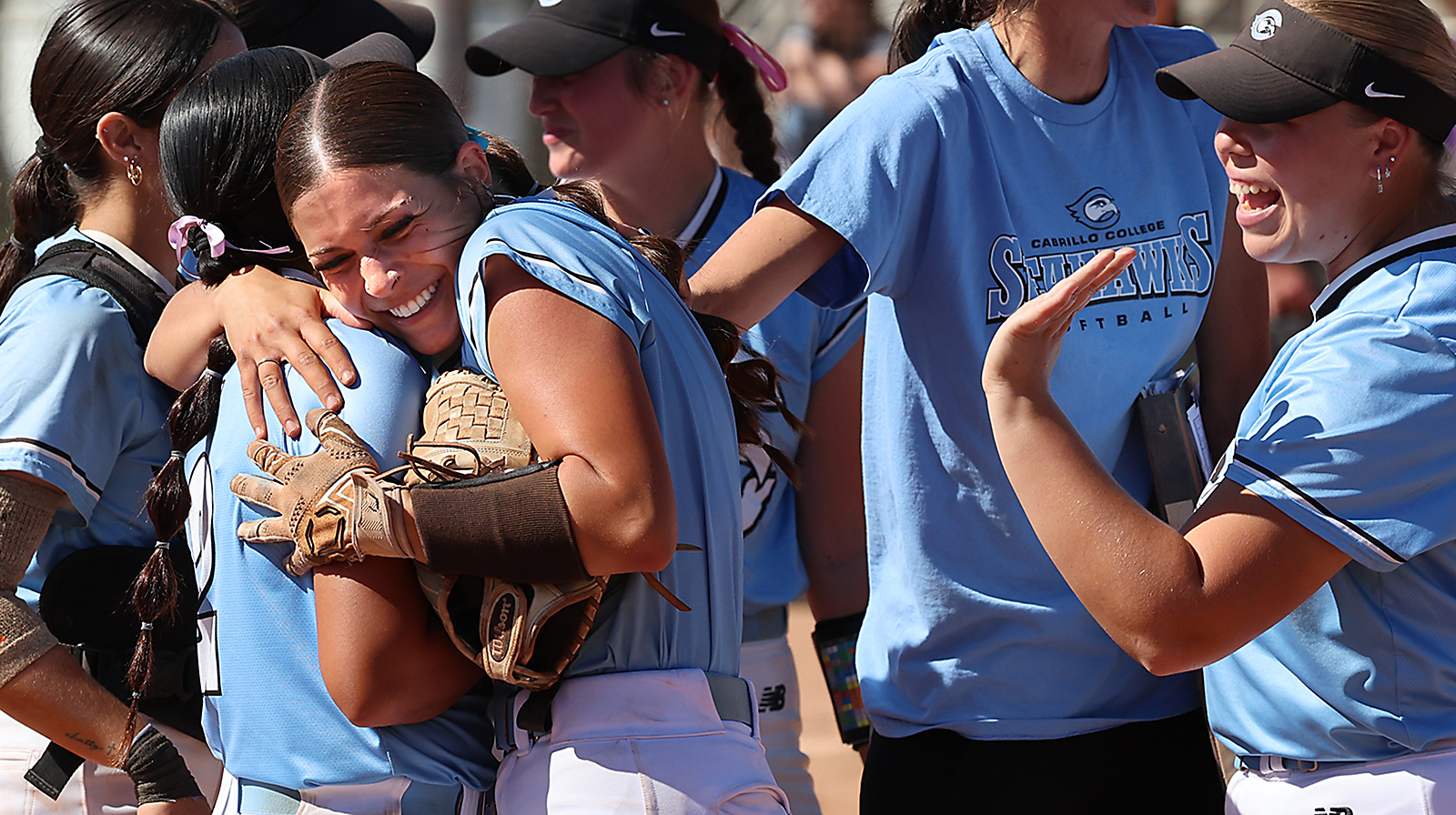 Cabrillo College's softball team celebrates its victory over visiting San...