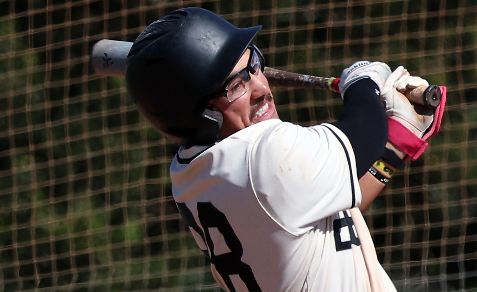 Cabrillo Collegeâs Dylan Bartlett smashes a ball to deep right...