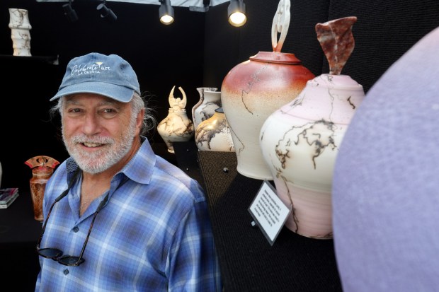 l Artist Jeffery Siegel with his porcelain clay ceramics at his booth during the Mission Fed Art Walk in Little Italy in San Diego on Sunday, April 26, 2026. (Hayne Palmour IV / For The San Diego Union-Tribune)