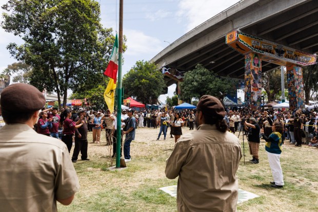Flags are raised in honor of Chicano Park Day, the 56th anniversary of the park, in Barrio Logan on Saturday, April 25, 2026. The day celebrates the community's effort to oppose the construction of a police station. (Kristian Carreon / The San Diego Union-Tribune)