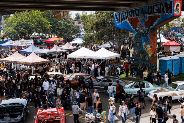 People gather for Chicano Park Day, the 56th anniversary of the park, in Barrio Logan on Saturday, April 25, 2026. The day celebrates the community's opposition to the construction of a police station in 1970. (Kristian Carreon / The San Diego Union-Tribune)