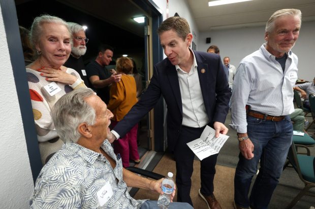 Rep. Mike Levin greets people as he arrives to speak to local Democrats at a meeting put on by the Rancho Santa Fe Democratic Club at the Del Mar Fairgrounds in Del Mar on Thursday, March 12, 2026. (Hayne Palmour IV / For The San Diego Union-Tribune)