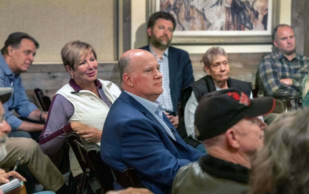 At a meeting of the Valley Center Republicans at the Country Trader event venue in Valley Center on March 31, 2026, Vista Mayor John Franklin, middle, listens to Republican candidate for state controller Herb Morgan speak. Franklin is running for County Supervisor District 5. (Charlie Neuman / For The San Diego Union-Tribune)