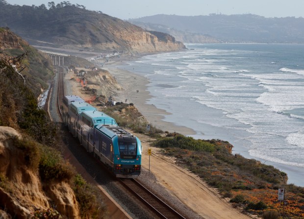 A Coaster train runs along the Del Mar bluffs on Tuesday, March 6, 2025. (K.C. Alfred / The San Diego Union-Tribune)