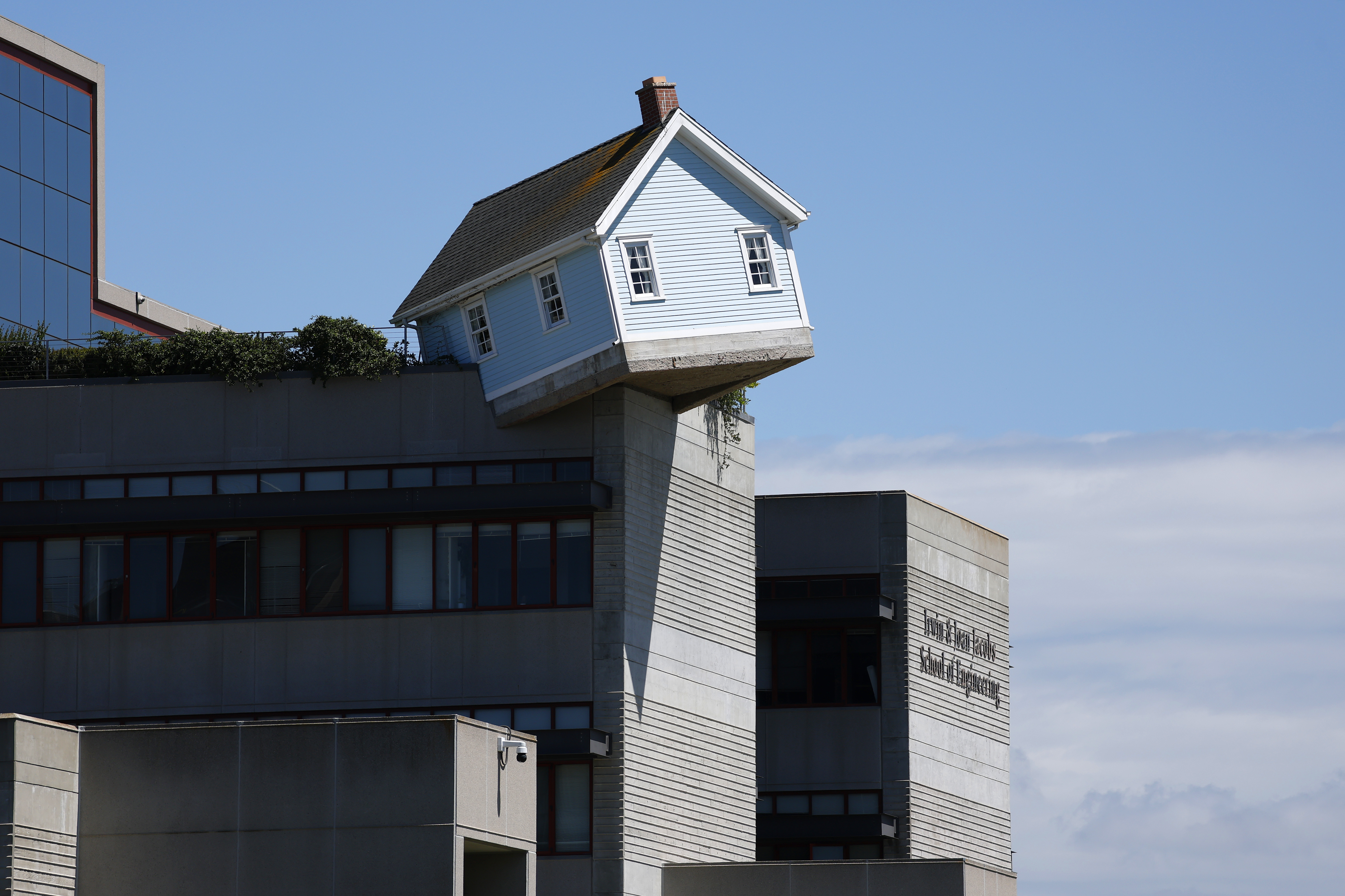 Fallen Star by artist Do Ho Suh hangs off the...