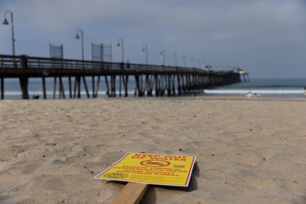 A keep out sign is seen by the Imperial Beach Pier on Wednesday, March 25, 2026. (Kristian Carreon / The San Diego Union-Tribune)