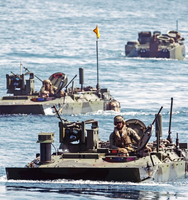 U.S. Marine Corps amphibious combat vehicles with Battalion Landing Team 3/5, 11th Marine Expeditionary Unit, prepare to embark the amphibious assault ship USS Boxer in the Pacific Ocean on Sept. 14. Elements of the 11th MEU embarked Boxer to conduct integrated training off the coast of Camp Pendleton. (Cpl. Joseph Helms / U.S. Marine Corps)