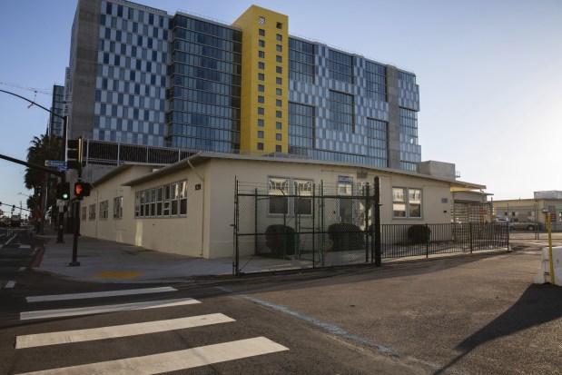 Dated, low-rise Navy buildings, pictured on March 2, 2023, currently occupy the 1220 Pacific Highway site proposed for the Navy SEAL Museum. (Adriana Heldiz / The San Diego Union-Tribune)