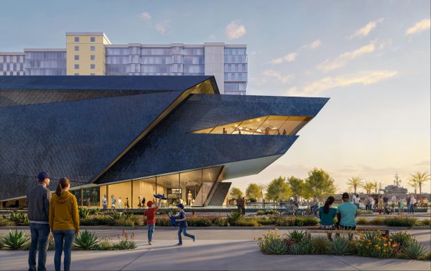 The unconventional, angular Navy SEAL Museum building features a perforated blue metal skin. A shallow, reflecting pool at the Harbor Drive entrance is meant to mirror the building's sculpted mass. (ZGF Architects)