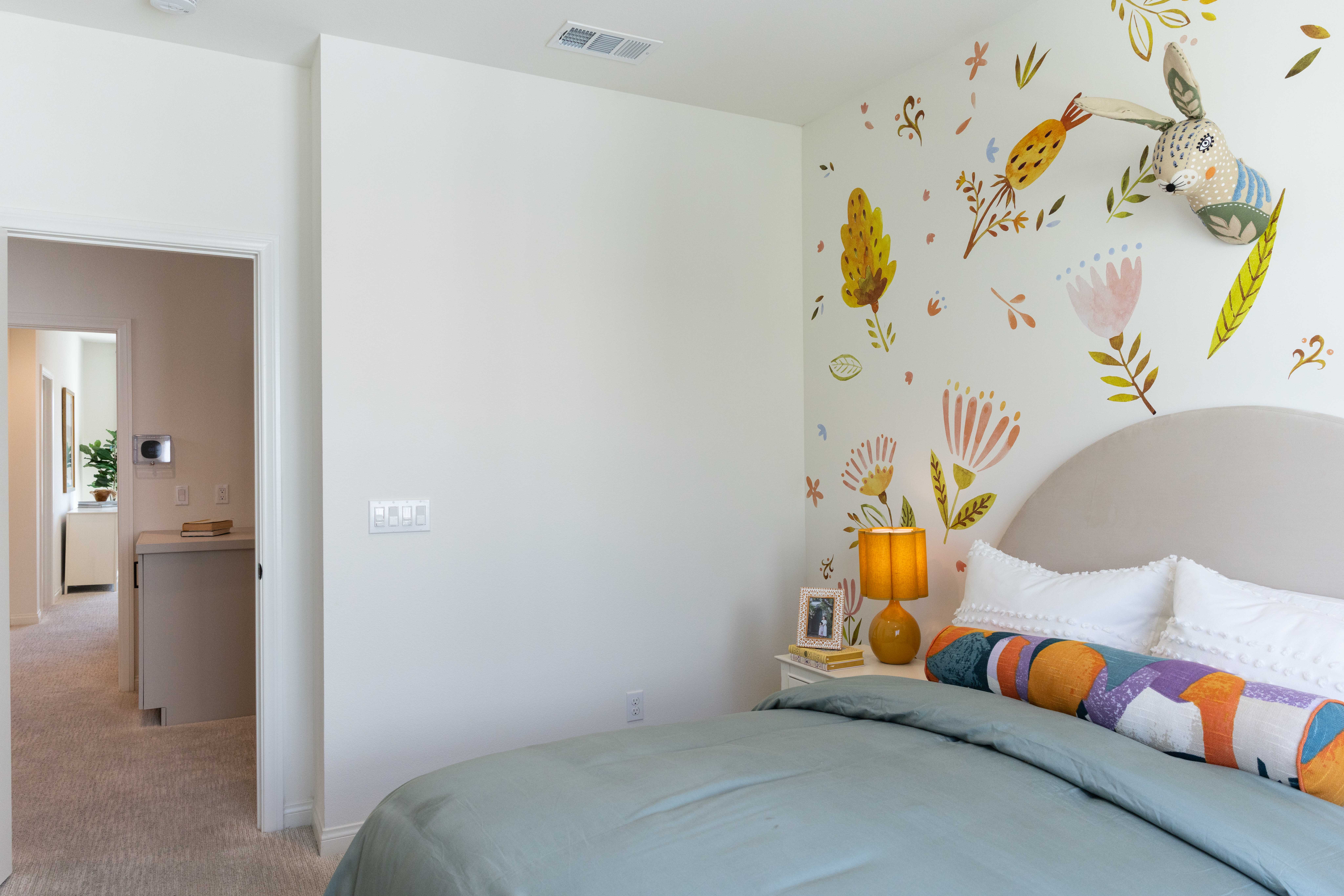 A bedroom in a new home in the Gateway townhome...
