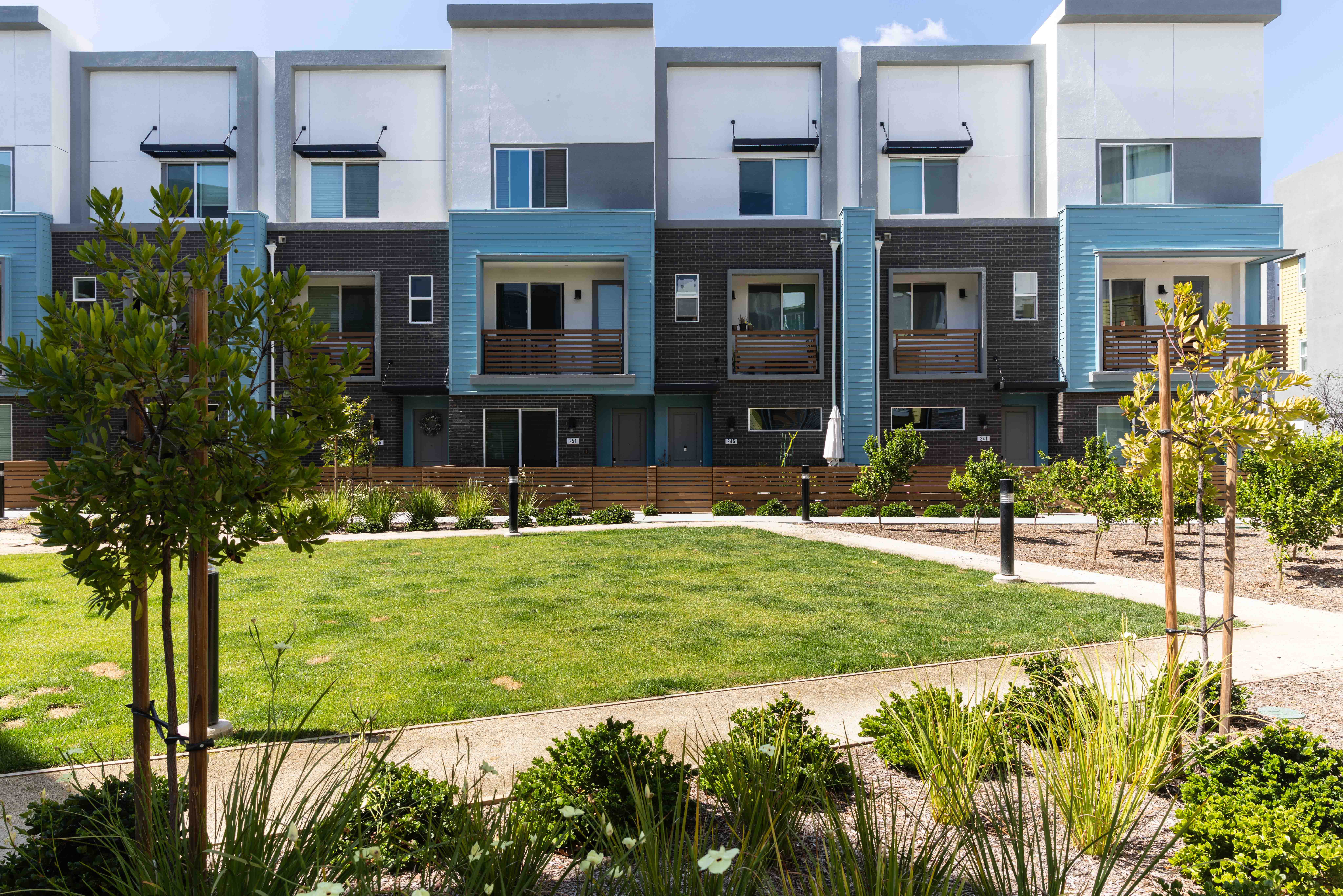 An outdoor courtyard at the Gateway townhome development in El...