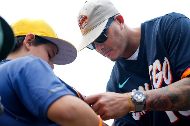 Manny Machado of the San Diego Padres signs autographs during the teamxe2x80x99s kids clinic at Liga Infantil de Beisbol Olmeca A.C on Friday, April 24, 2026 in Mexico City, . (Meg McLaughlin / The San Diego Union-Tribune)