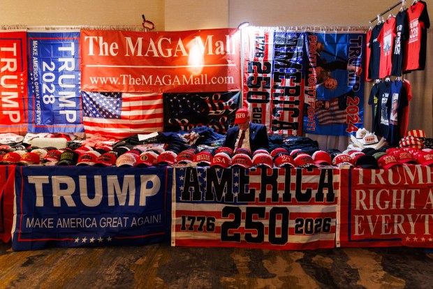 Ronald Solomon sits at his booth selling President Donald Trump gear during the 2026 California Republican Party Spring Convention at the Sheraton San Diego Resort on Saturday, April 11, 2026. (Kristian Carreon / The San Diego Union-Tribune)