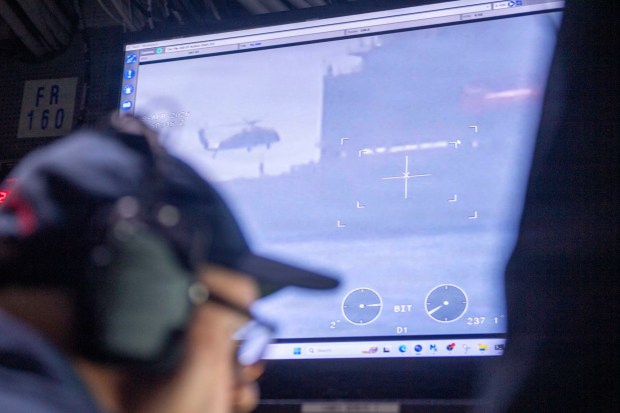 On April 19, 2026, the San Diego-based aircraft carrier USS Theodore Roosevelt participated in a training exercise with a sea drone, or so-called unmanned surface vessel. The Roosevelt may soon become the first carrier to deploy with an integrated and operational sea drone. (Courtesy of US Navy). 