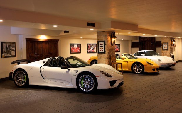 A 2015 Porsche 918 Spyder Weissach, left, owned by Bill Ceno is displayed at his home on April 8, 2026 in Rancho Santa Fe, CA.(K.C. Alfred / The San Diego Union-Tribune)