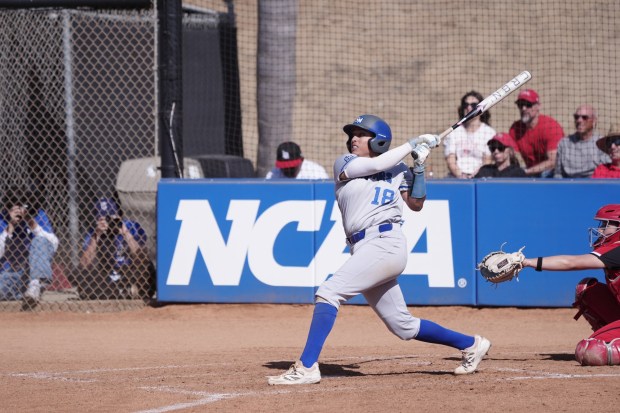 Jillian Albayati follows through on a swing. (Cal State San Marcos athletics)