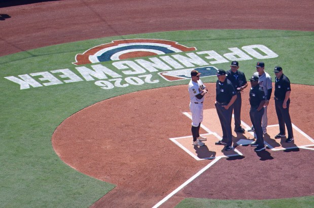 Manager A.J. Hinch #14 of the Detroit Tigers and manager Craig Stammen of the San Diego Padres stand at home plate with umpires before a game on opening day at Petco Park on March 26, 2026 in San Diego, CA. (K.C. Alfred / The San Diego Union-Tribune)