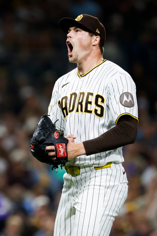Mason Miller #22 of the San Diego Padres celebrates after striking out Willi Castro #3 of the Colorado Rockies during the ninth inning at Petco Park on Thursday, April 9, 2026 in San Diego, California. (Meg McLaughlin / The San Diego Union-Tribune)
