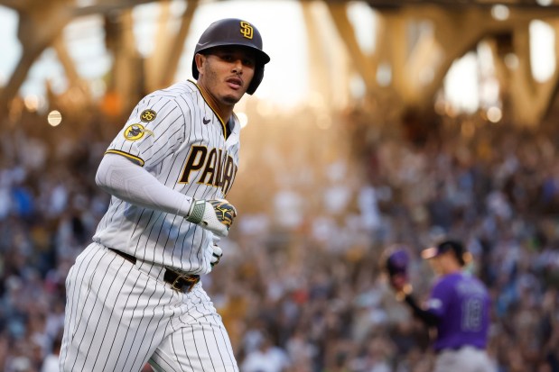 Manny Machado #13 of the San Diego Padres celebrates after his home run against the Colorado Rockies during the third inning at Petco Park on Saturday, April 11, 2026 in San Diego, California. (Meg McLaughlin / The San Diego Union-Tribune)