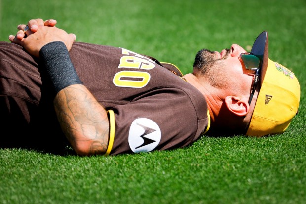 Nick Castellanos #21 of the San Diego Padres stretches before their spring training game against the Seattle Mariners at the Peoria Sports Complex on Thursday, March 5, 2026 in Peoria, Ariz.(Meg McLaughlin / The San Diego Union-Tribune)
